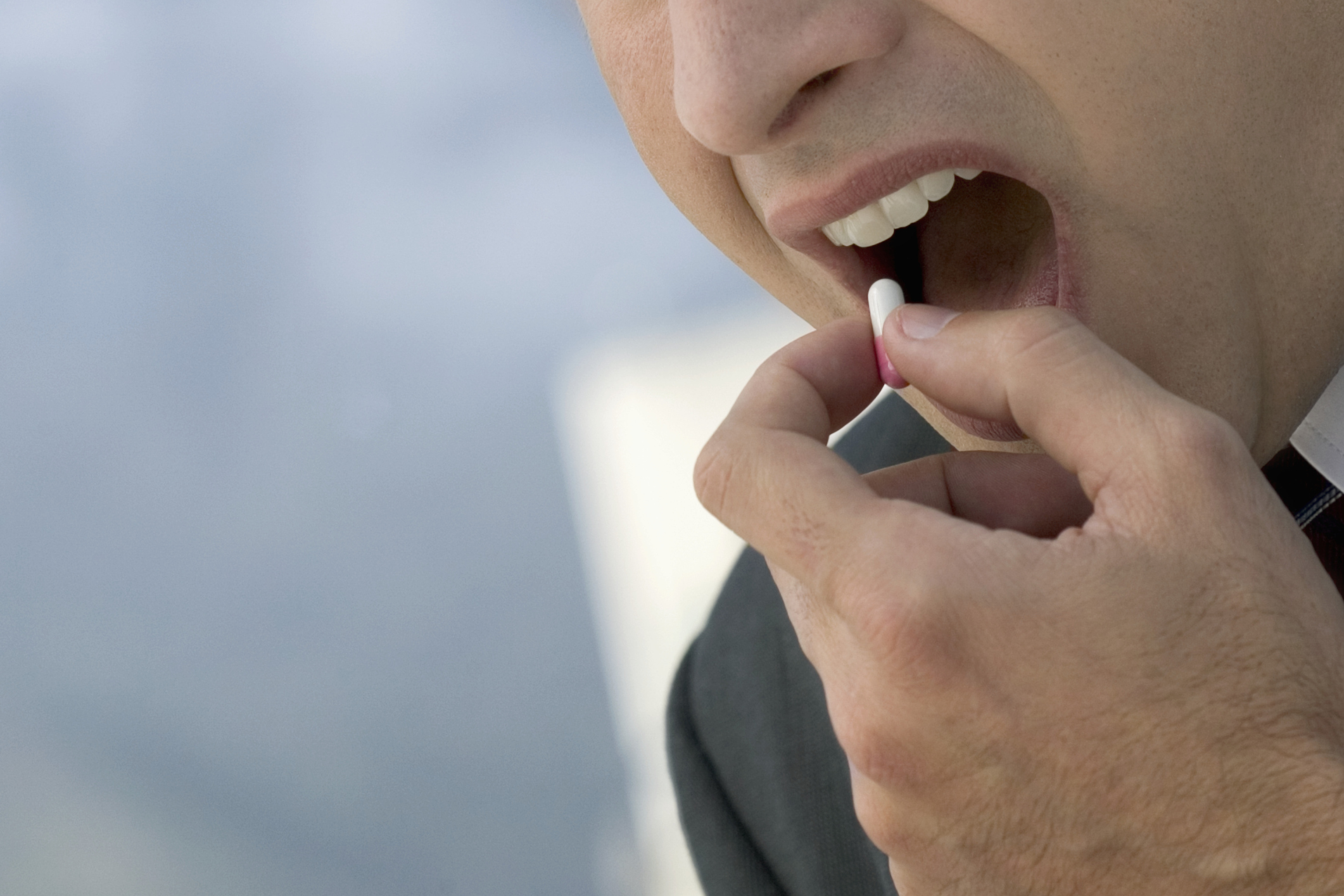 Businessman Taking Pill