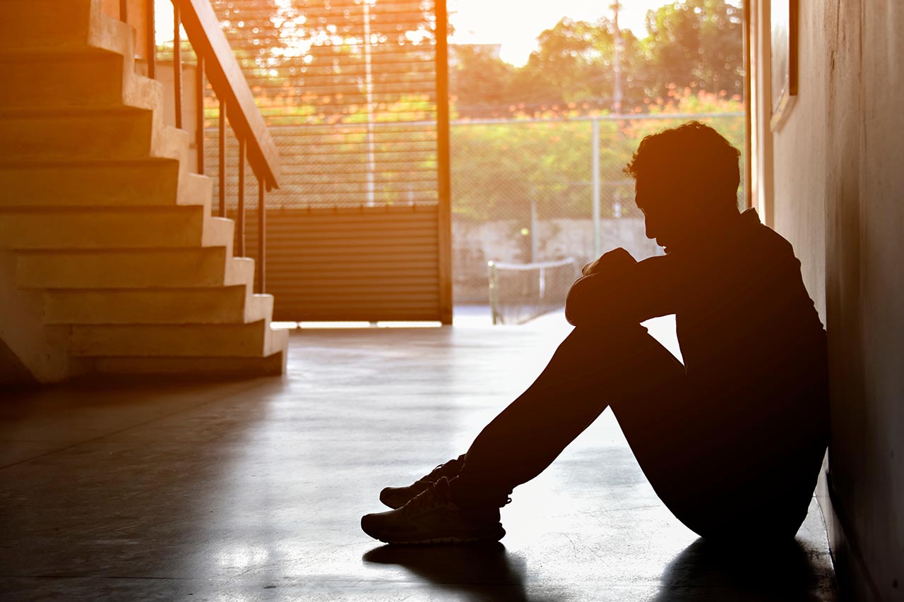 man sitting on floor