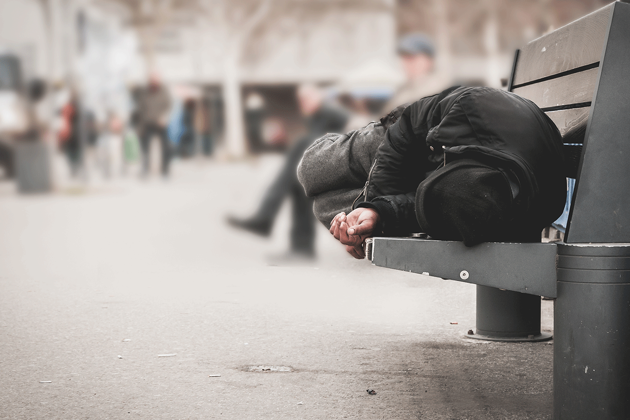 man sleeping on bench