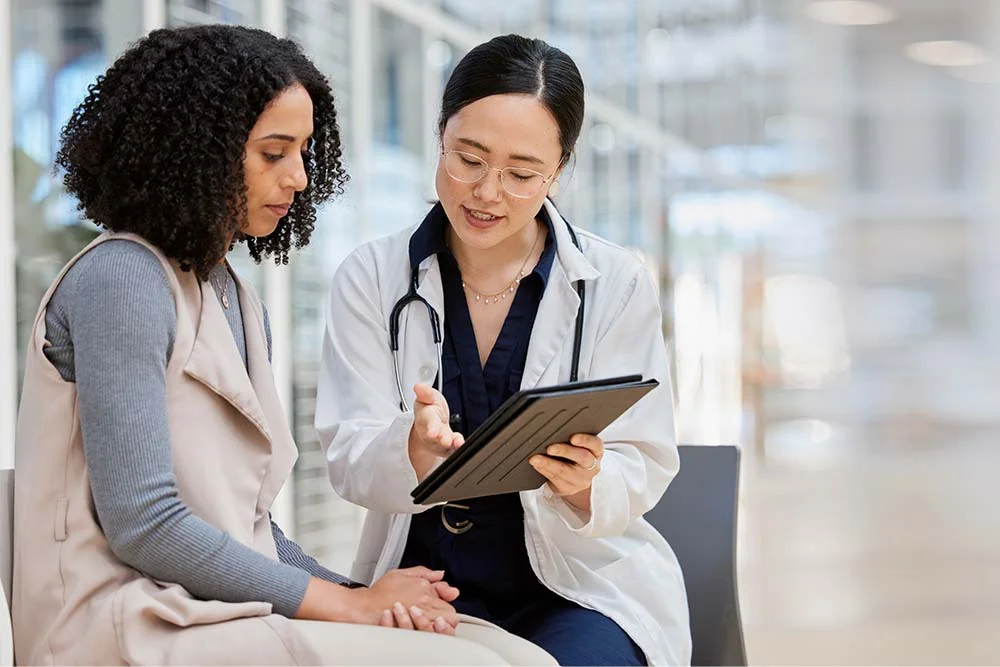 a clinician talking a patient about medical detox options