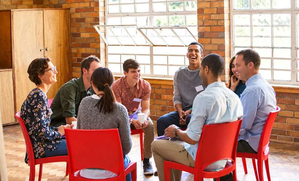 people smiling during therapy for anxiety treatment